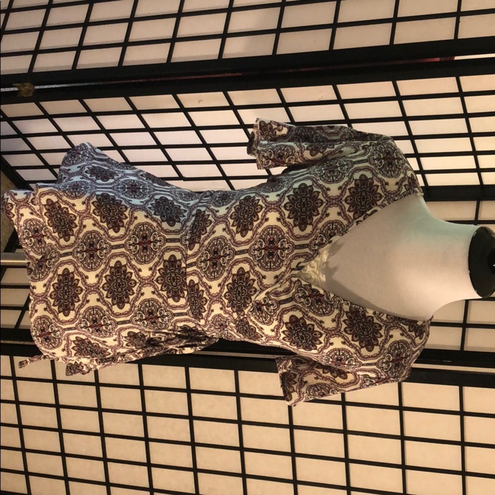 Beautiful retro patterned tie and low cut shirt.